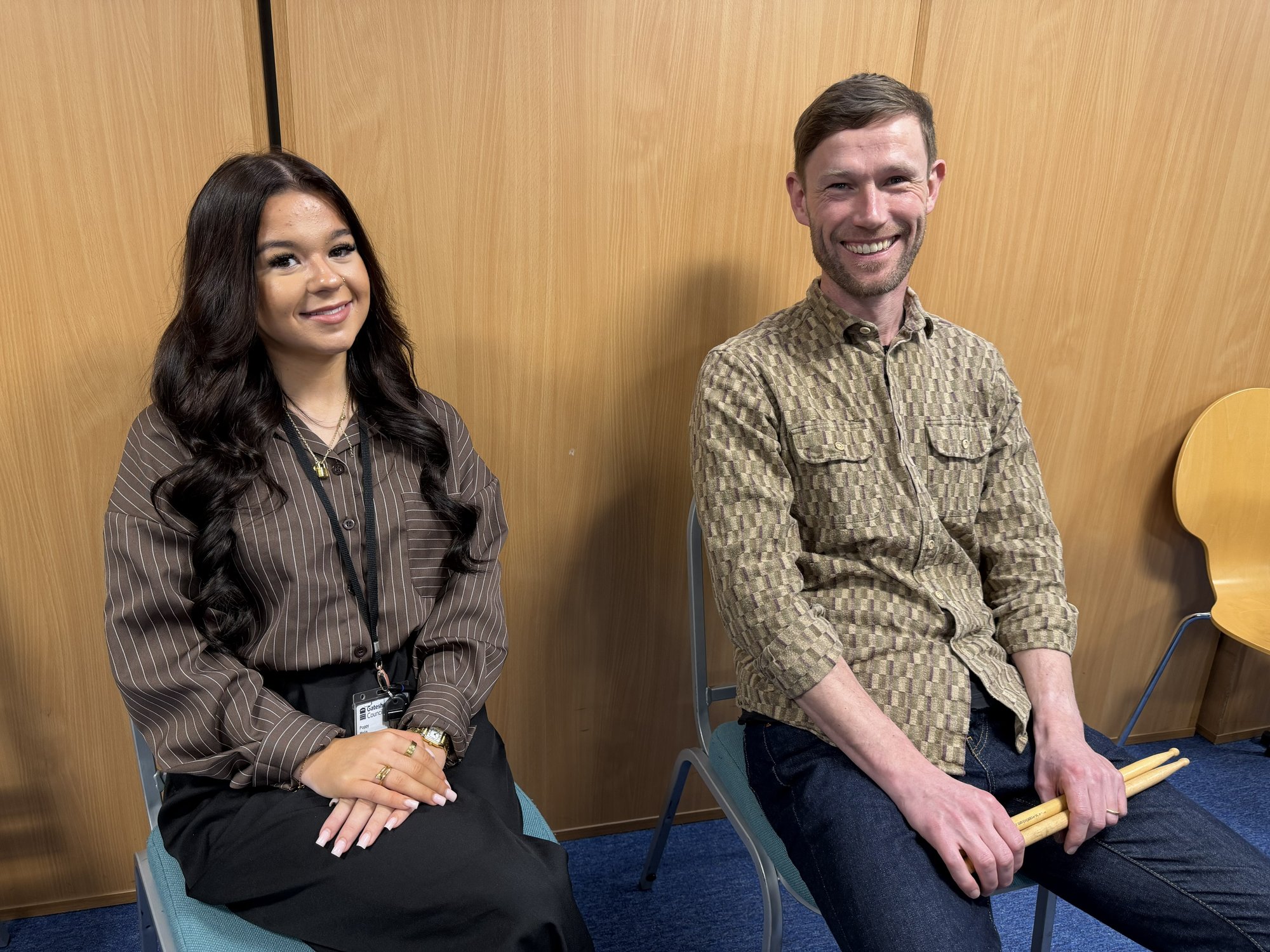 Two existing staff members taking part in apprenticeship training to develop their skills.